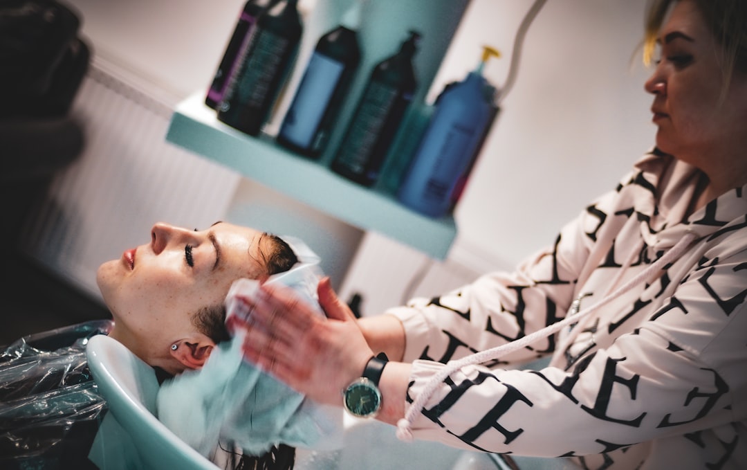 Stylist at work with client